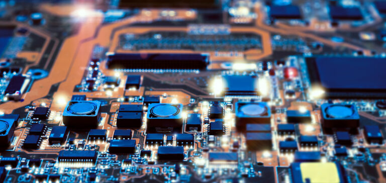 Closeup-on-electronic-board-in-hardware-repair-shop-blurred-and-toned-image